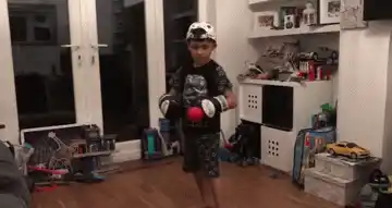 Child practicing with reflex ball